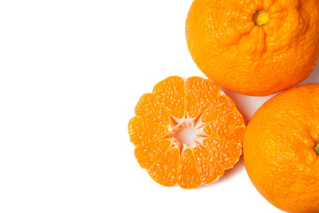 Ripe tangerines and slices isolated on white background