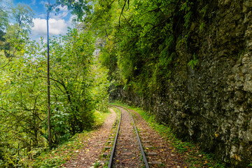 Fototapeta na wymiar Old narrow gauge railway in mountain region.