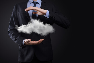 Businessman man hand holding cloud.Cloud computing concept, close up of young business man with cloud over his hand.The concept of cloud service.