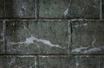 blurred background of a fragment of a gray stone wall