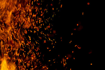 flame of fire with sparks on a black background