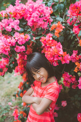 Portrait of little girl pictured on a colorful flower background