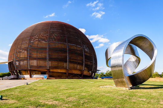 Meyrin, Switzerland - September 7, 2020: The steel ribbon titled "Wandering the Immeasurable" by Gayle Hermick and the Globe of Science and Innovation at CERN, the European Center for Nuclear Research