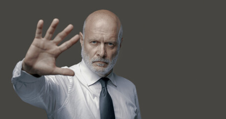 Business executive making a stop gesture