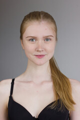 Young woman in black underwear standing over white studio background. Snap, set.