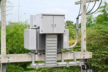AC high voltage transformers to supply electricity, installed on cement poles, transfer electrical...