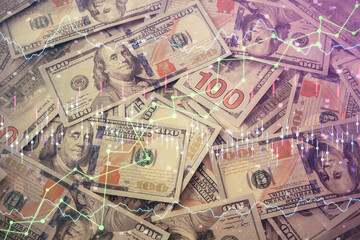 Multi exposure of forex chart drawing over us dollars bill background. Concept of financial success markets.