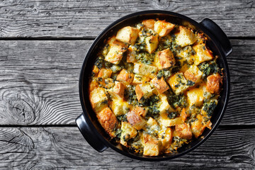 Spinach and cheese strata, top view, copy space