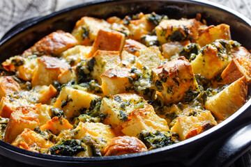 Italian strata on a black baking dish, top view