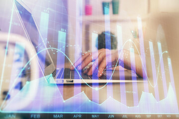 Double exposure of woman hands typing on computer and forex chart hologram drawing. Stock market invest concept.