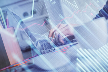 Double exposure of woman hands typing on computer and forex chart hologram drawing. Stock market invest concept.