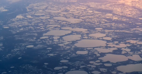 View from airplane on Earth surface - a group of small lakes.