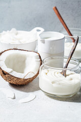 Vegan coconut products - milk, yogurt and chips, white background. Coconut food concept.