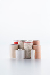 variety of bandages, gauze, cotton and Scotch tap on white background.