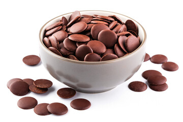 Chocolate chips or granules for making melted chocolate in a bowl on white background....