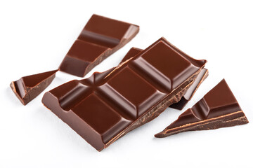 Pieces of dark chocolate on white background. Chocolate bar. Chocolate confection.