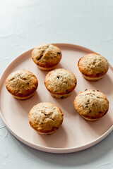 Chocolate banana muffins on a round pink dish