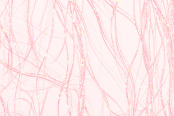festive holographic tinsel fringe detail on pastel pink background
