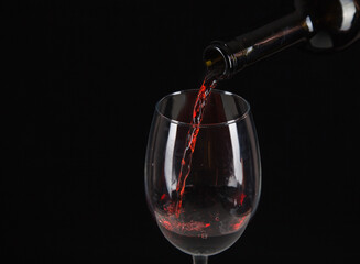 Fototapeta na wymiar red wine is poured into a glass