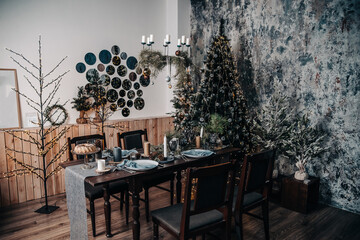 Christmas table with chairs in a room with festive decor