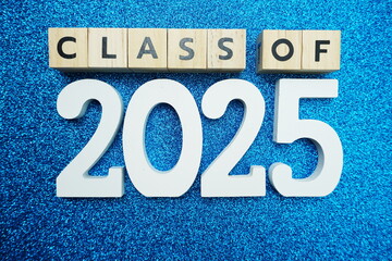 Class of 2025 word alphabet letters on blue glitter background
