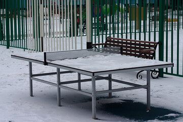 tennis table on the playground in the courtyard in winter