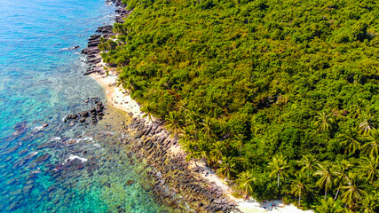 Aerial view of beautiful landscape, tourism boats, and people swimming on the sea and beach on May Rut island (a tranquil island with beautiful beach) in Phu Quoc, Kien Giang, Vietnam.