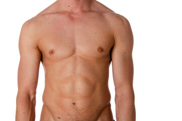 Fototapeta premium Fashion portrait of strong brutal guy with a modern trendy hairstyle. Sexy torso. Male flexing his muscles. Sport workout bodybuilding.