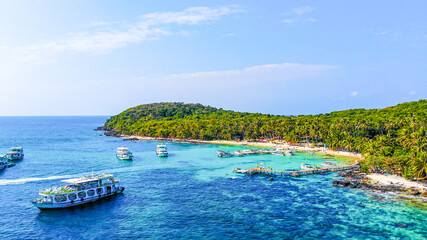 Aerial view of beautiful landscape, tourism boats, and people swimming on the sea and beach on May...