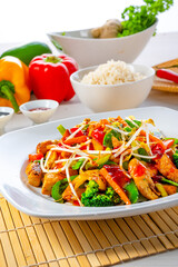 sweet and sour chicken with rice and vegetables
