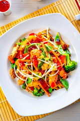 sweet and sour chicken with rice and vegetables