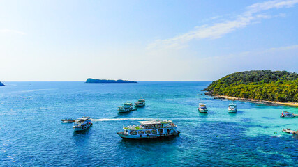 Fototapeta na wymiar Aerial view of beautiful landscape, tourism boats, and people swimming on the sea and beach on May Rut island (a tranquil island with beautiful beach) in Phu Quoc, Kien Giang, Vietnam.