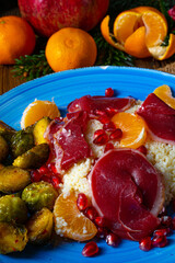 Cured goose breast with Brussels sprouts, mandarins and pomegranate