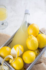 Traditional Italian liqueur Limoncello liqueur and fresh citrus fruits