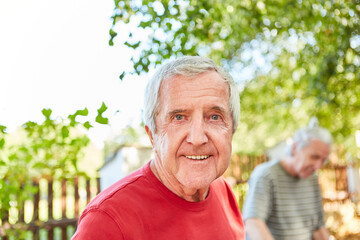 Sympathetic senior as a pensioner in the garden