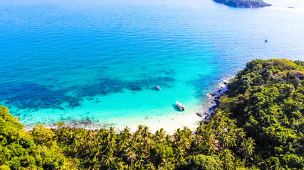 Aerial view of beautiful landscape, tourism boats, and people swimming on the sea and beach on May Rut island (a tranquil island with beautiful beach) in Phu Quoc, Kien Giang, Vietnam.