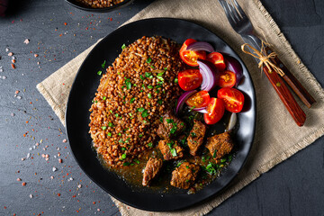 Buckwheat groats baked in the oven with beef goulash