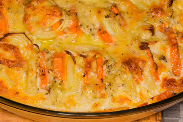 Fragment of baking dish with vegetable casserole close-up