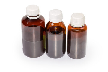 Brown glass and plastic bottles of liquid medicines different sizes