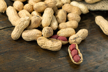 Peanuts on a wooden table. Inshell nuts.