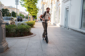Fototapeta premium fun driving electric scooter through the city.