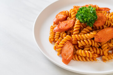spirali or spiral pasta with tomato sauce