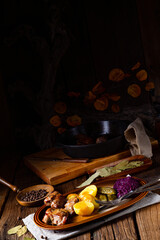 Rustic Snirtjebraten with red cabbage and cucumber