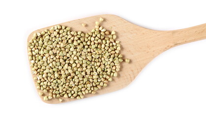 Peeled buckwheat seeds in wooden spoon isolated on white background, top view