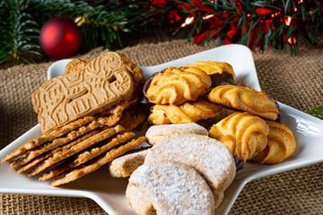 Different types of biscuits with rustic Christmas decorations