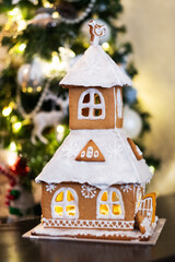 Delicious homemade Gingerbread House. Decoration New Year's table.