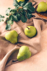 Fresh ripe pears on table