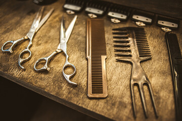 combs and scissors for haircuts lie on a shelf in the cabin