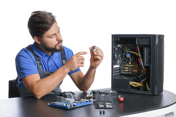 Technician repairing computer on white background
