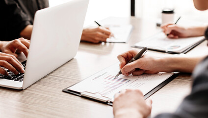 group of the employees analyzing financial charts